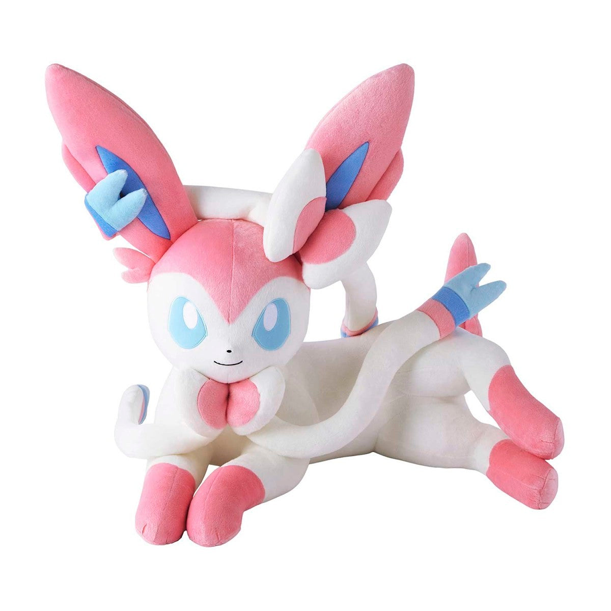 Plush toy of a pink and white creature with large ears on a white background