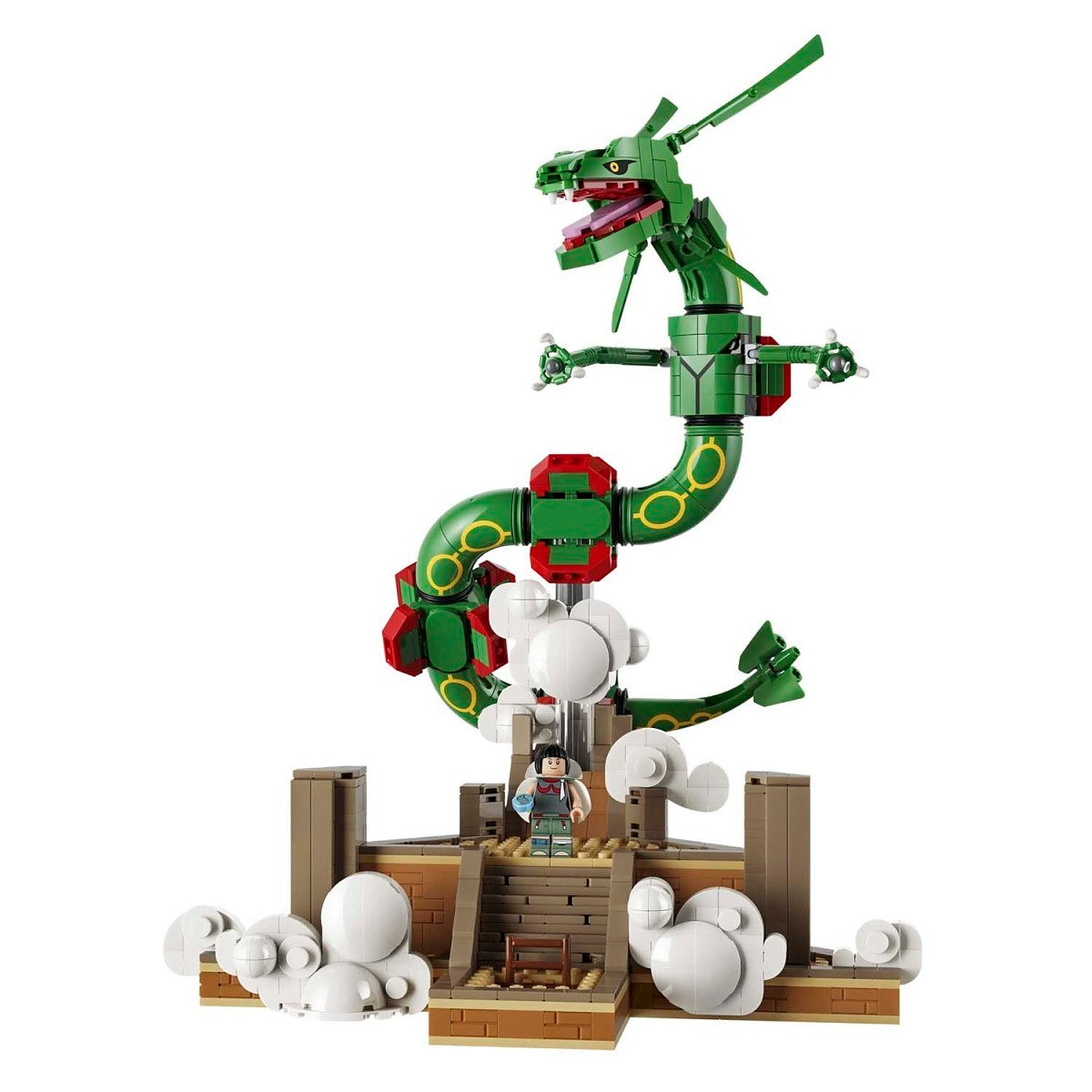 A green dragon toy building block set with a small character minifigure, standing on a brown platform with white cloud pieces, isolated on a white background.