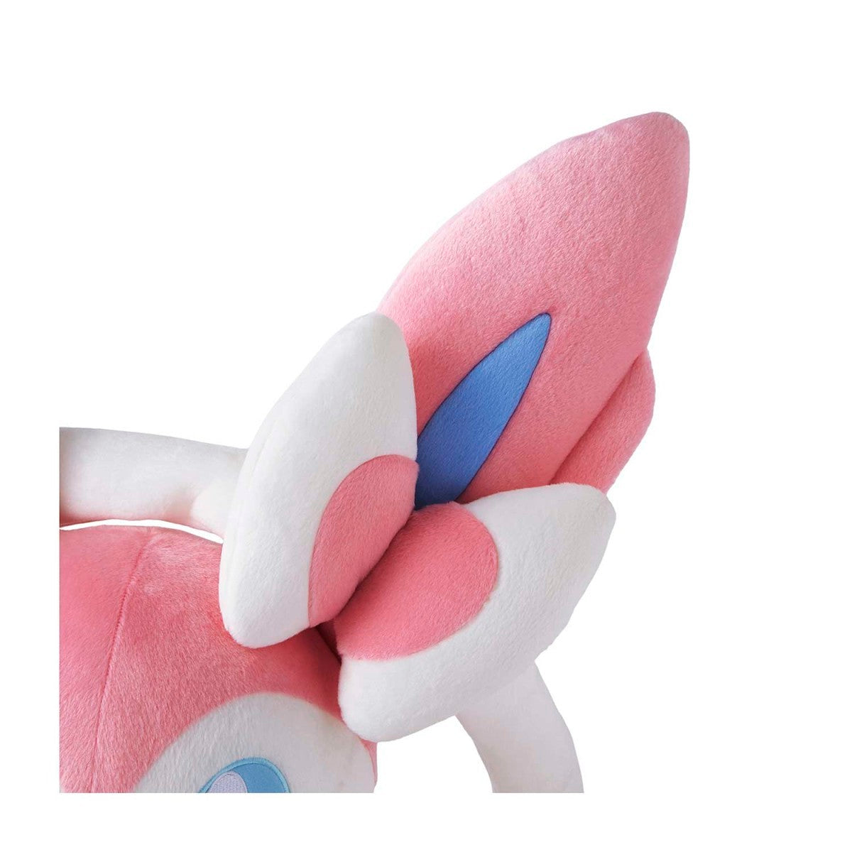 Close-up of pink and white butterfly-shaped plush toy on a white background