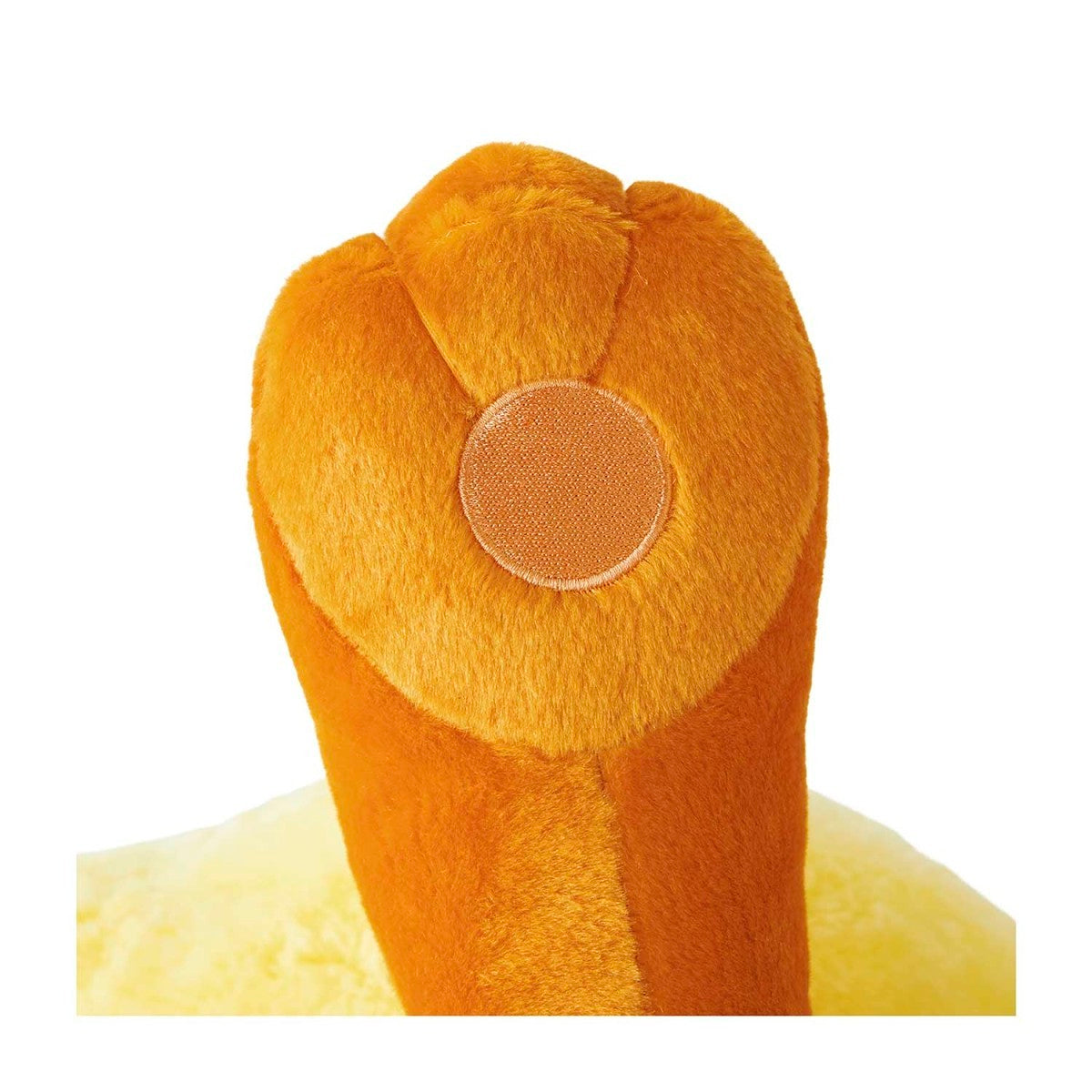 Close-up of a plush toy resembling a lion's head on a white background