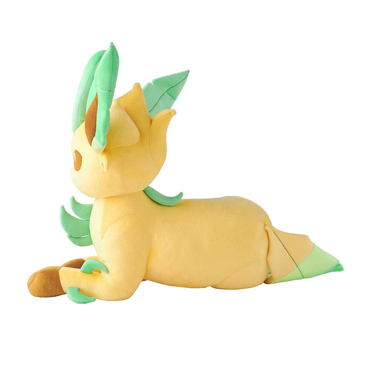 A yellow and mint green plush toy of a lemur-like Pokémon, shown lying down on a plain white background.