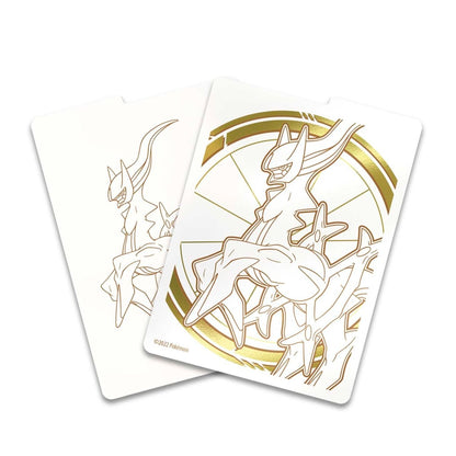 Two cards featuring a stylized creature design with gold accents on a white background