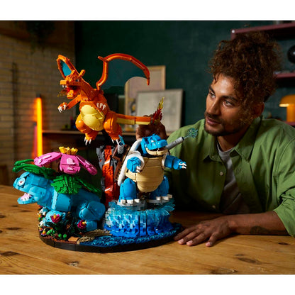 Man interacting with a colorful toy set on a wooden table